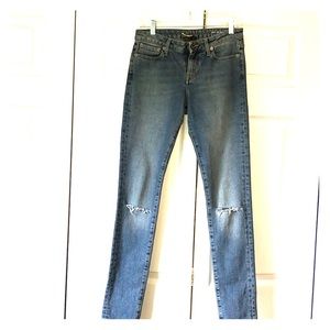 YSL jeans with knee rips